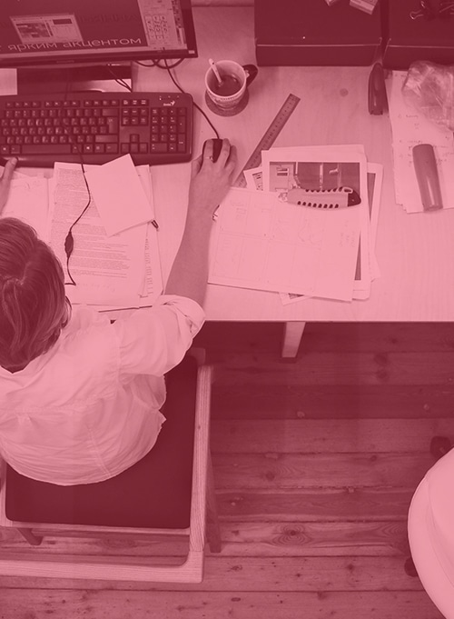 Man working at messy desk